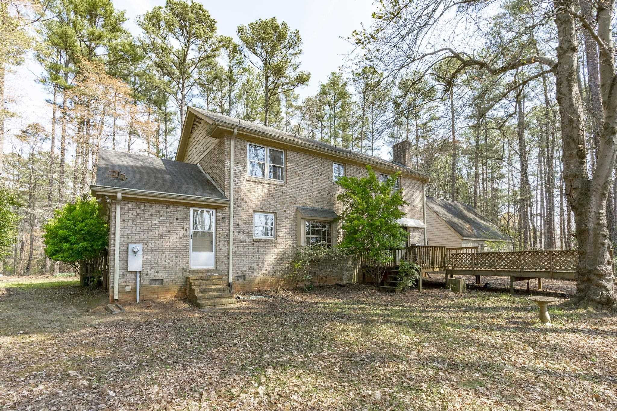 12801 Strickland Road Raleigh, NC 27613 - Photo 14 of 27 a view of a house with a yard