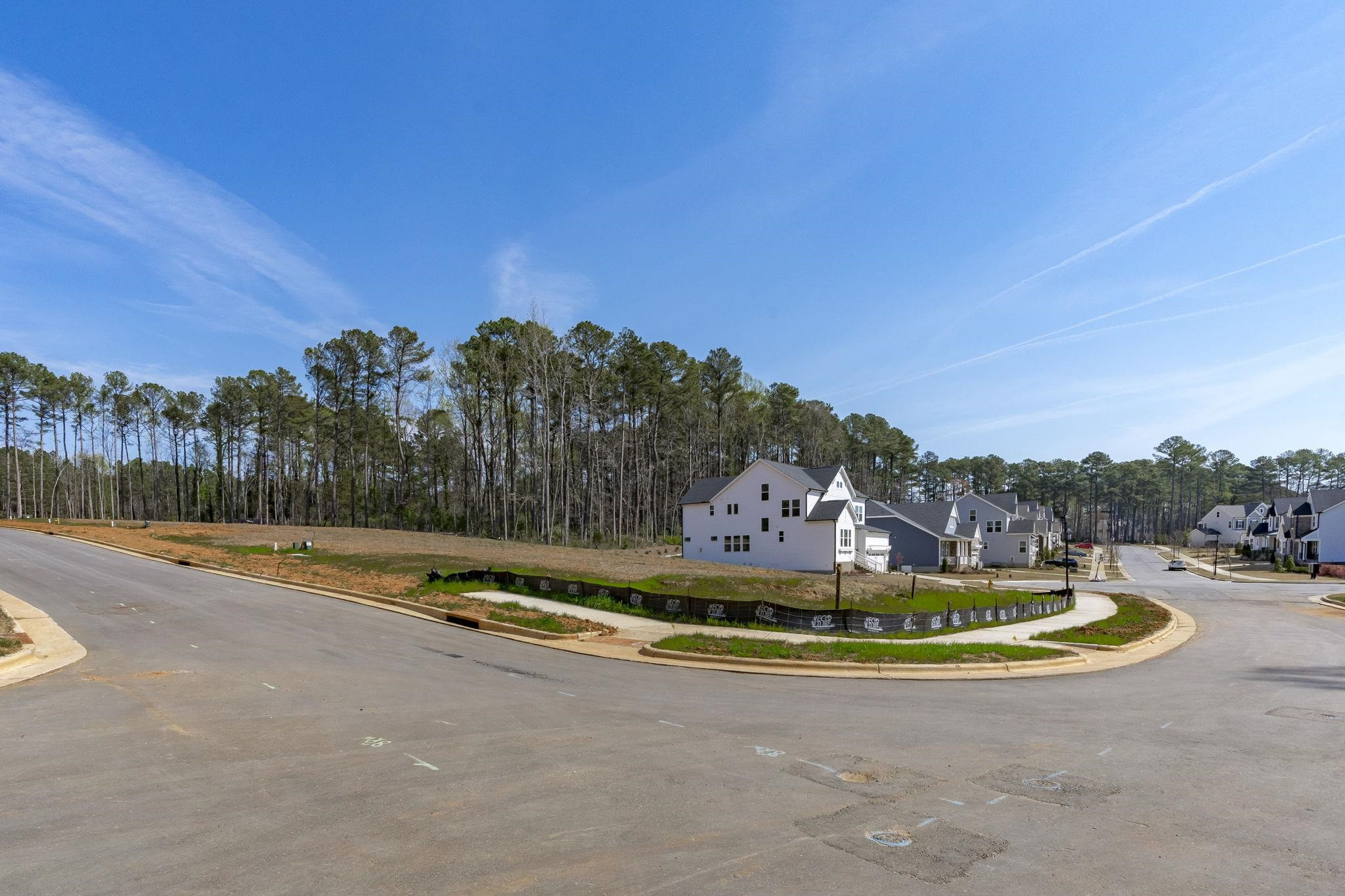 12801 Strickland Road Raleigh, NC 27613 - Photo 22 of 27 a view of a swimming pool and trees in the background