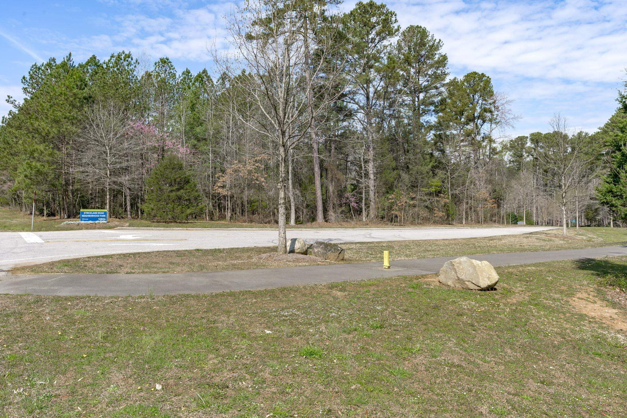 12801 Strickland Road Raleigh, NC 27613 - Photo 7 of 27 a view of a house with a yard