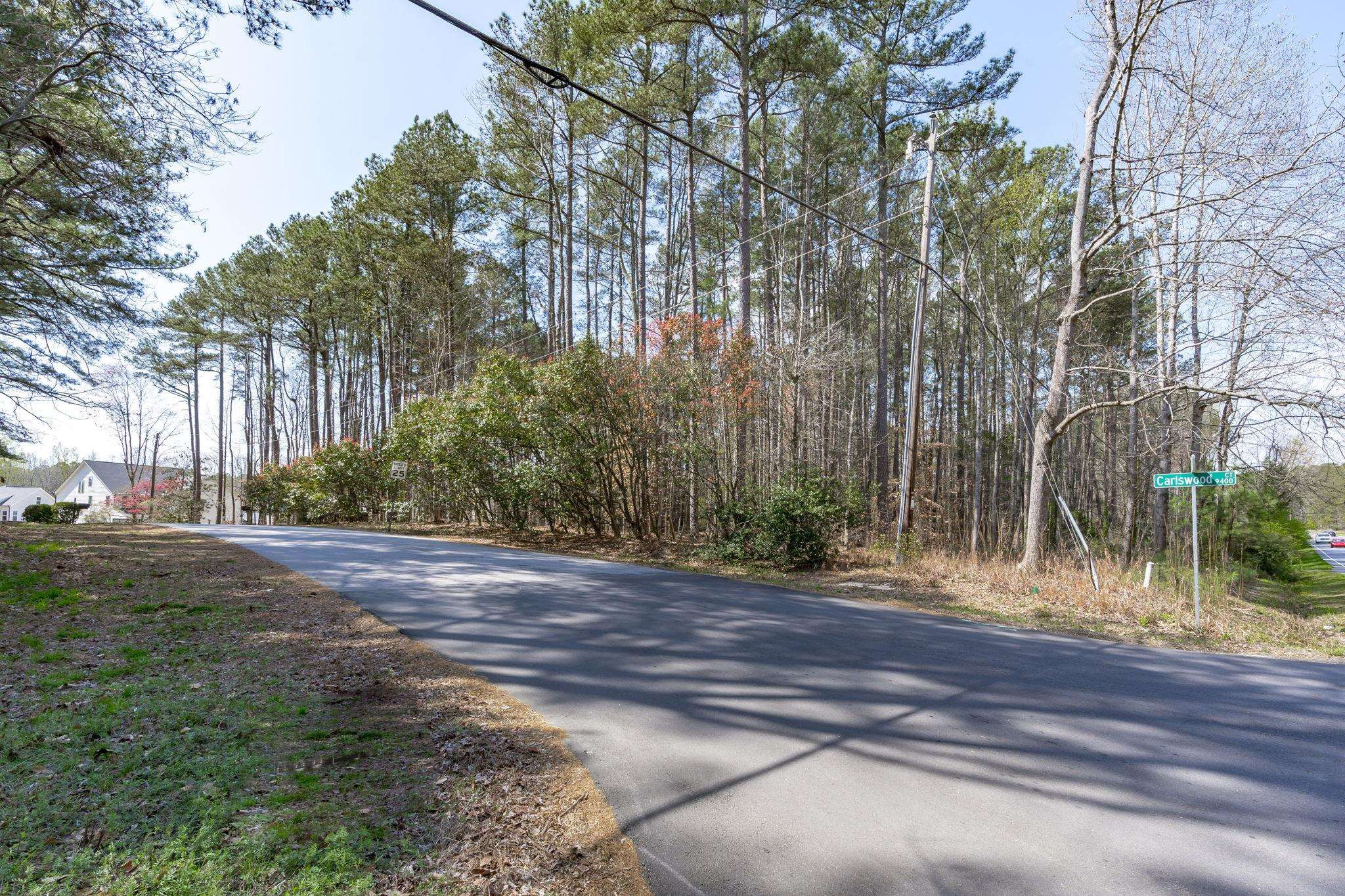12801 Strickland Road Raleigh, NC 27613 - Photo 8 of 27 a view of a house with a street