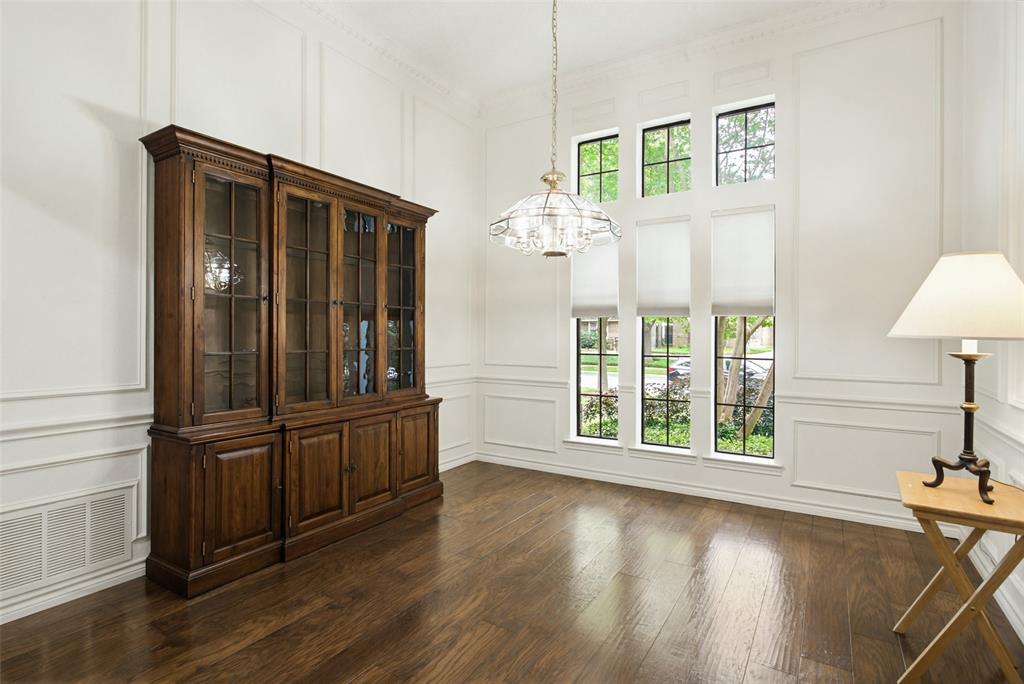 2905 Valleyview Drive Grapevine, TX 76051 - Photo 2 of 12 an empty room with wooden floor fan and windows