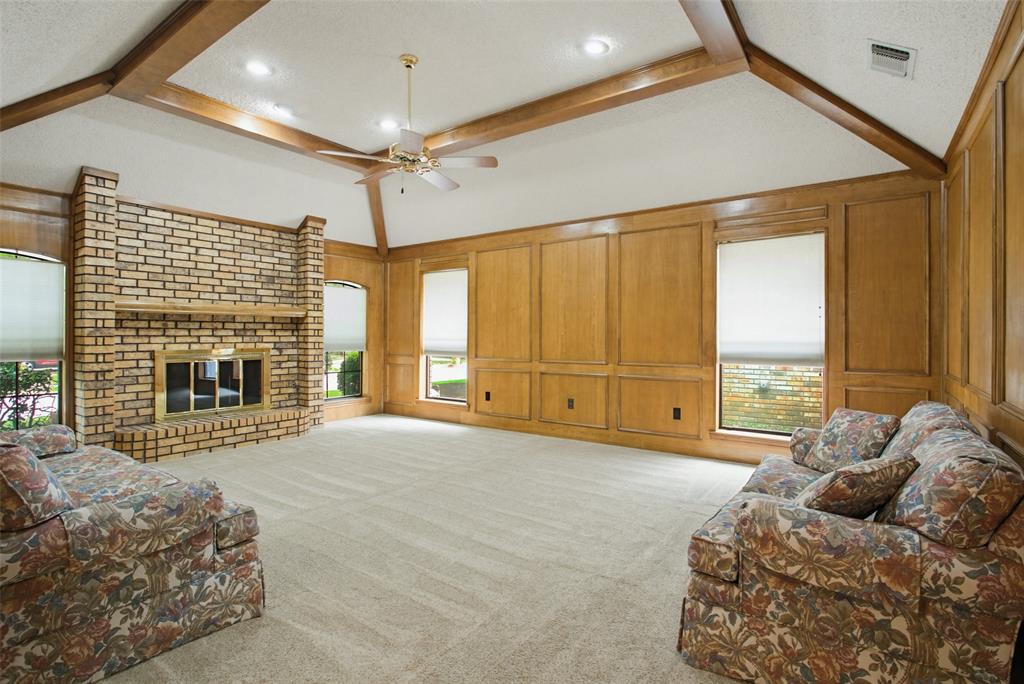 2905 Valleyview Drive Grapevine, TX 76051 - Photo 4 of 12 a spacious bedroom with a large bed and a fireplace