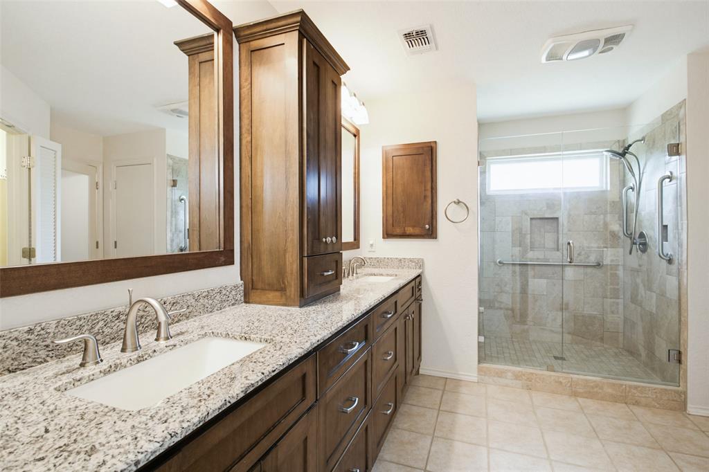 2905 Valleyview Drive Grapevine, TX 76051 - Photo 8 of 12 a bathroom with a granite countertop double vanity sink mirror and shower