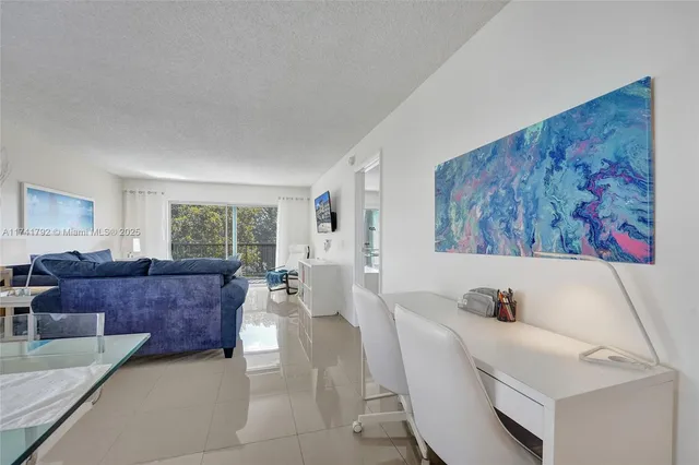 a living room with a couch and a window