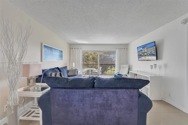 a view of a livingroom with furniture and window