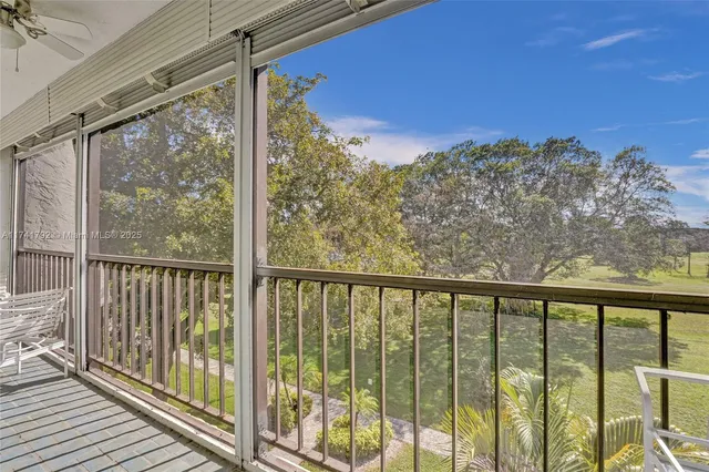 a view of a balcony with furniture