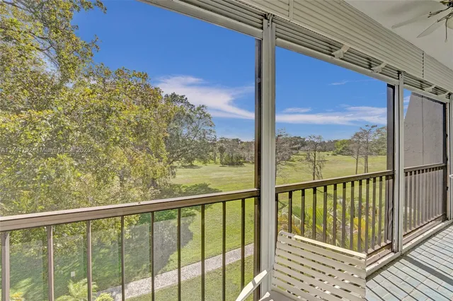 a view of a balcony with chair