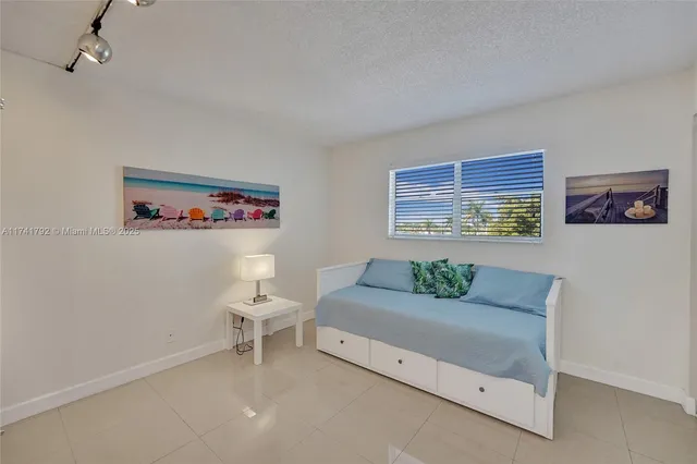a living room with furniture and windows