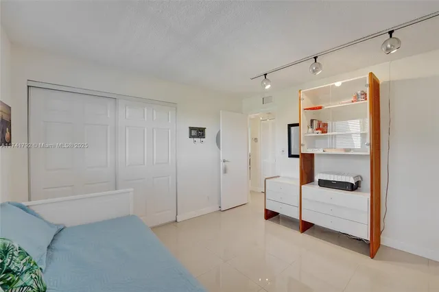 a bathroom with a sink mirror vanity and toilet
