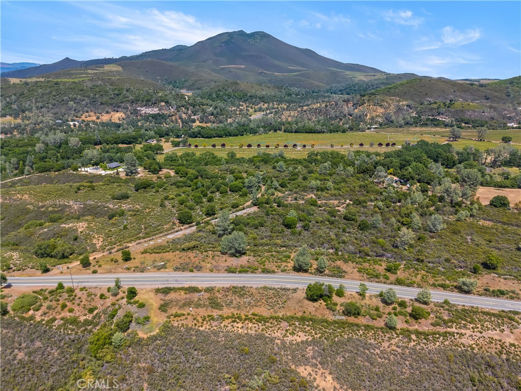 8152 Bottle Rock Road Kelseyville, CA 95451 - Photo 4 of 28 a view of a lush green hillside and houses