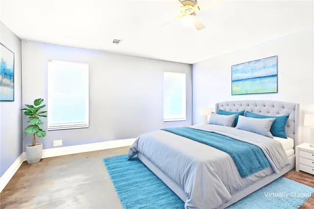 a bedroom with bed and a window