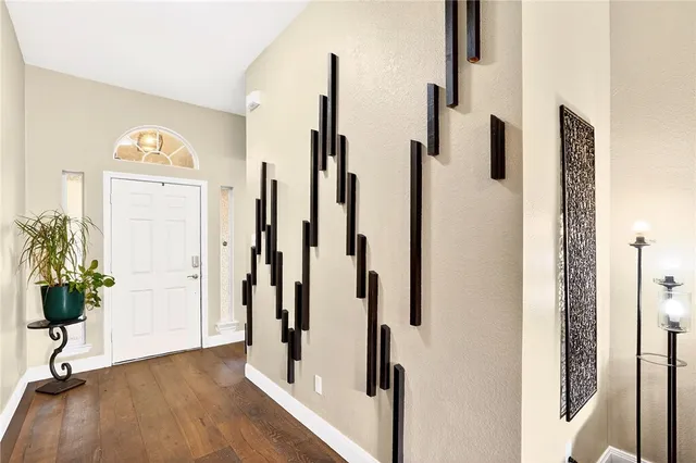 a view of front door with wooden floor