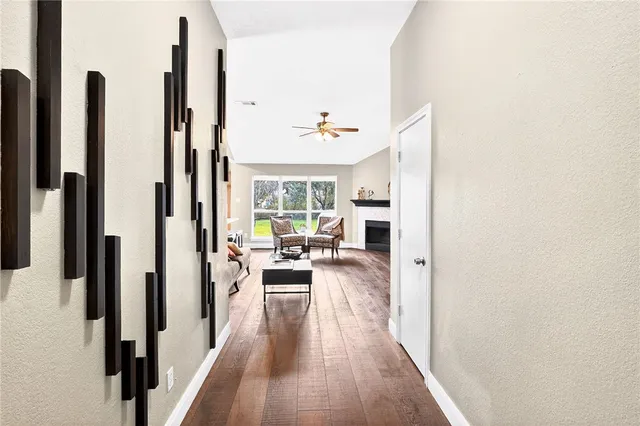a view of a living room with furniture and a window
