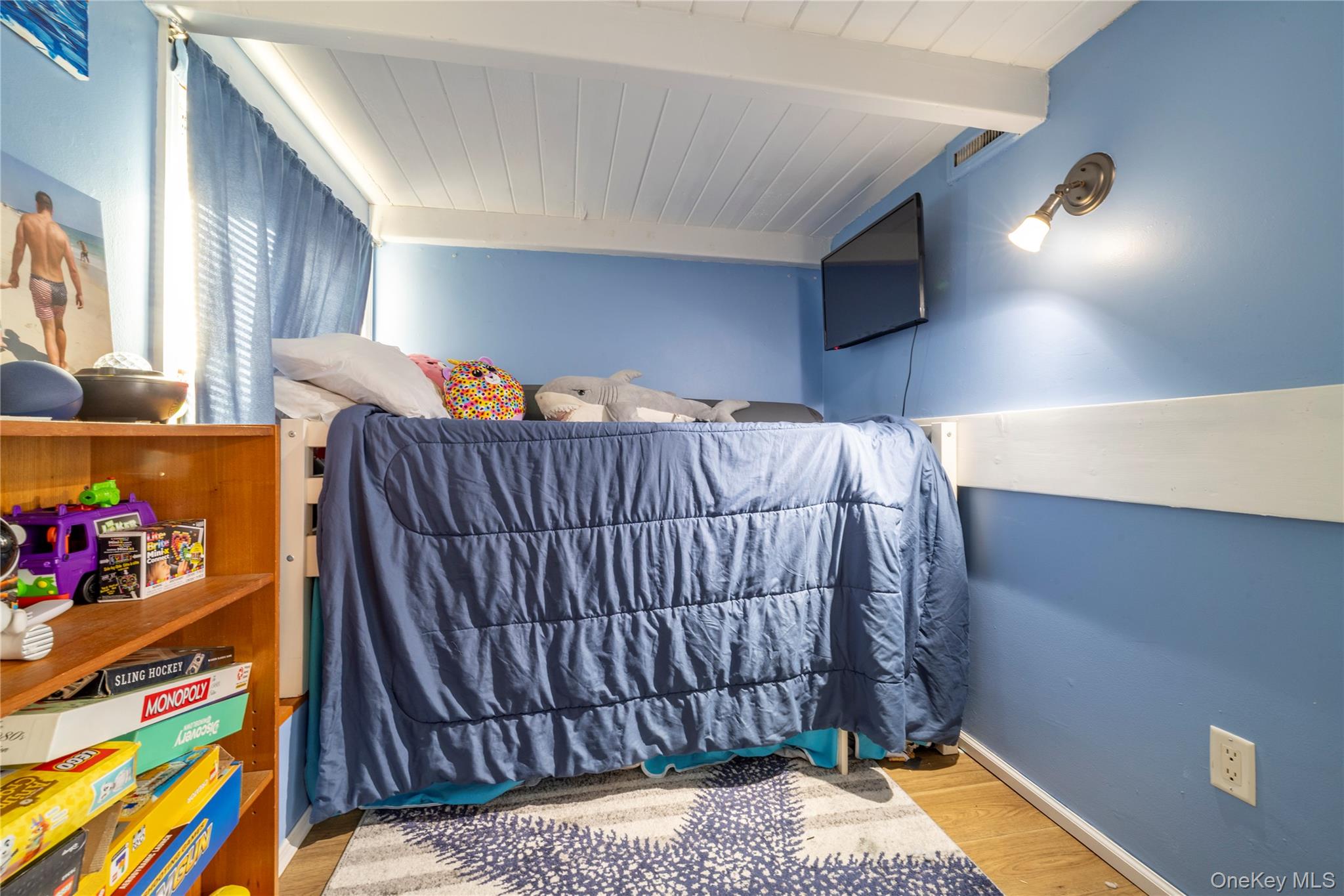 220 Shore Road Seaford, NY 11783 - Photo 16 of 23 a bedroom with a bed and a window