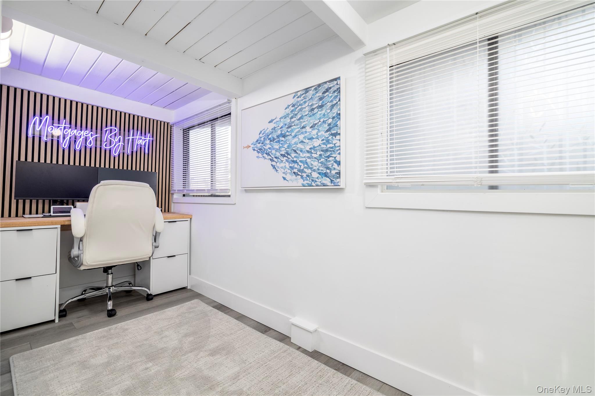 220 Shore Road Seaford, NY 11783 - Photo 17 of 23 a view of a workspace with furniture and a window