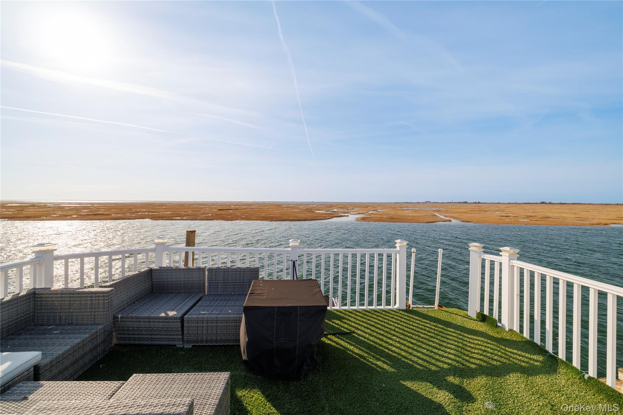 220 Shore Road Seaford, NY 11783 - Photo 22 of 23 a view of a terrace with outdoor seating