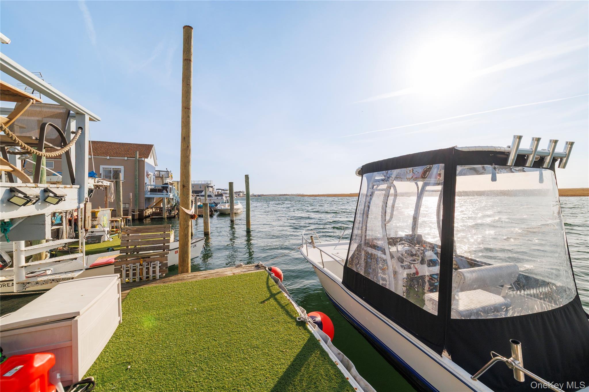 220 Shore Road Seaford, NY 11783 - Photo 23 of 23 a view of a balcony with floor to ceiling windows and wooden fence