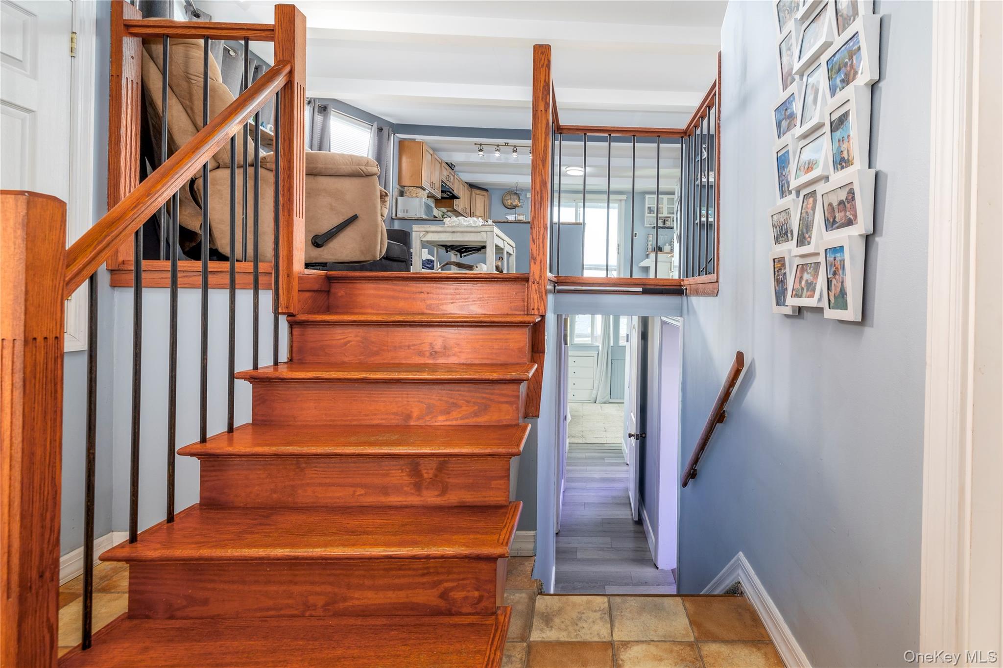 220 Shore Road Seaford, NY 11783 - Photo 6 of 23 a view of entryway and hall with wooden floor