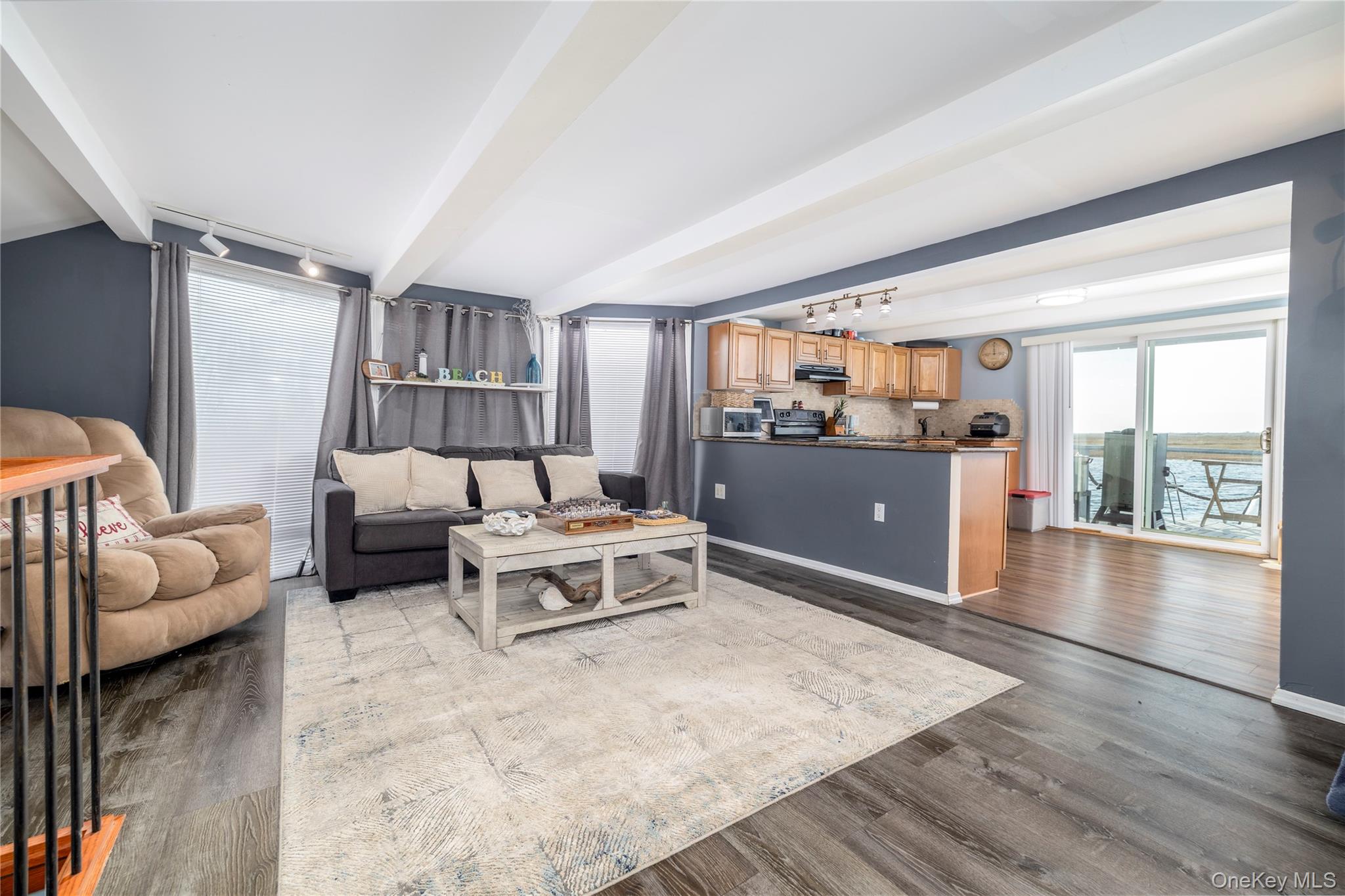 220 Shore Road Seaford, NY 11783 - Photo 7 of 23 a living room with furniture and a wooden floor