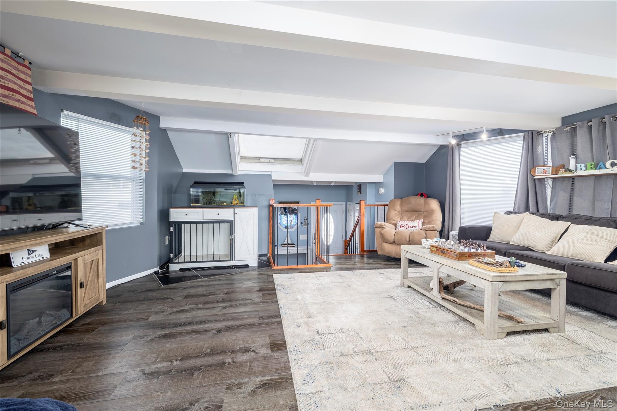 220 Shore Road Seaford, NY 11783 - Photo 9 of 23 a living room with furniture and a fireplace
