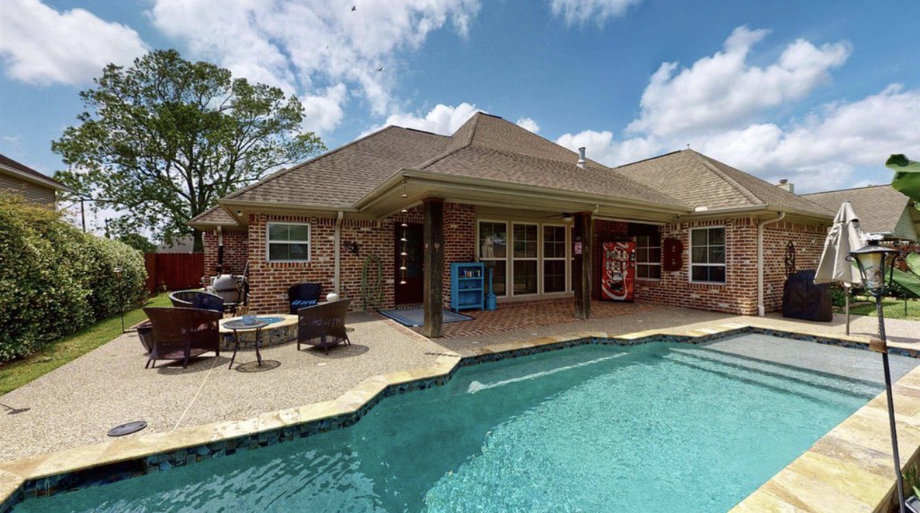 104 Mockingbird Lane Bridge City, TX 77611 - Photo 1 of 27 a view of a house with a patio and a yard