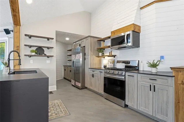 a view of a livingroom with table and chairs