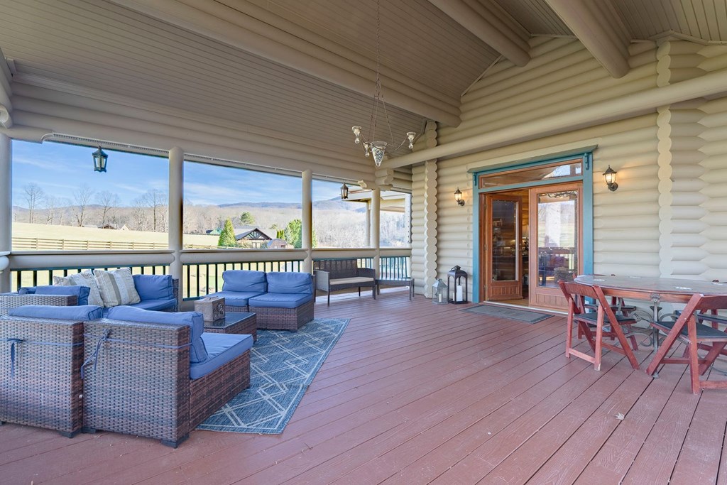 201 Mountainside Parkway Ellijay, GA 30536 - Photo 24 of 78 a living room with furniture and large windows