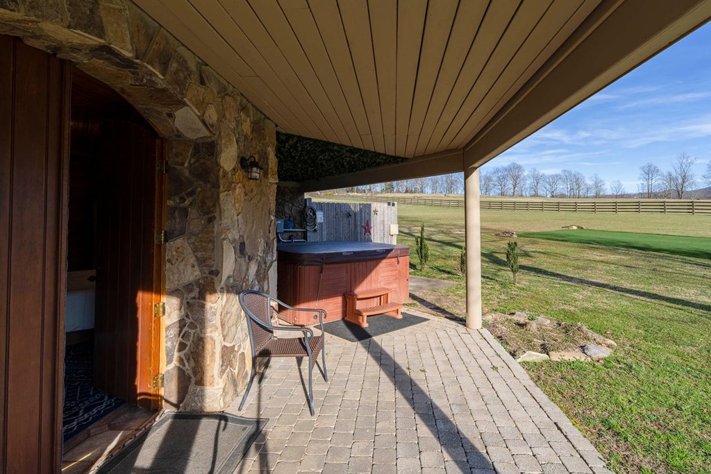 201 Mountainside Parkway Ellijay, GA 30536 - Photo 33 of 78 a view of a balcony with chair and wooden floor