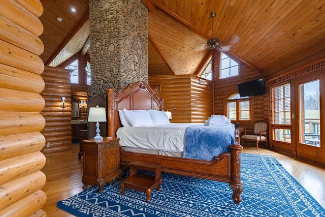 a view of balcony with furniture and umbrella