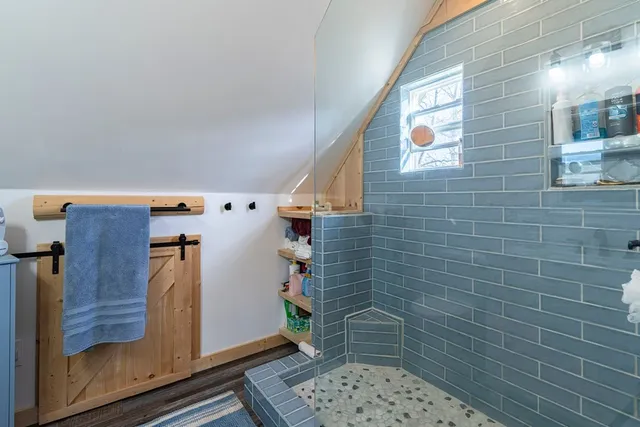 front view of a brick house with a yard