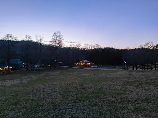 a view of a house with pool and lake view