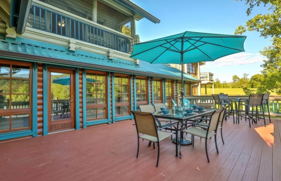 201 Mountainside Parkway Ellijay, GA 30536 - Photo 61 of 78 a view of balcony with furniture and umbrella