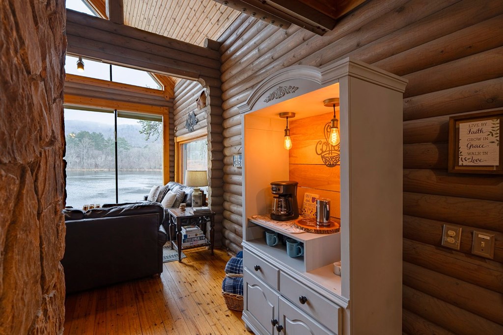 201 Mountainside Parkway Ellijay, GA 30536 - Photo 9 of 78 a view of a living room and dining room with wooden floor