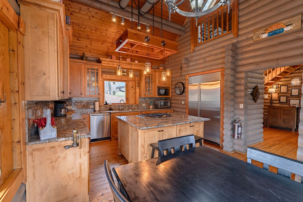 201 Mountainside Parkway Ellijay, GA 30536 - Photo 10 of 78 a kitchen that has a lot of cabinets in it