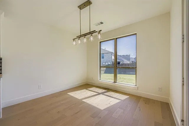 a kitchen with kitchen island a sink stainless steel appliances and cabinets