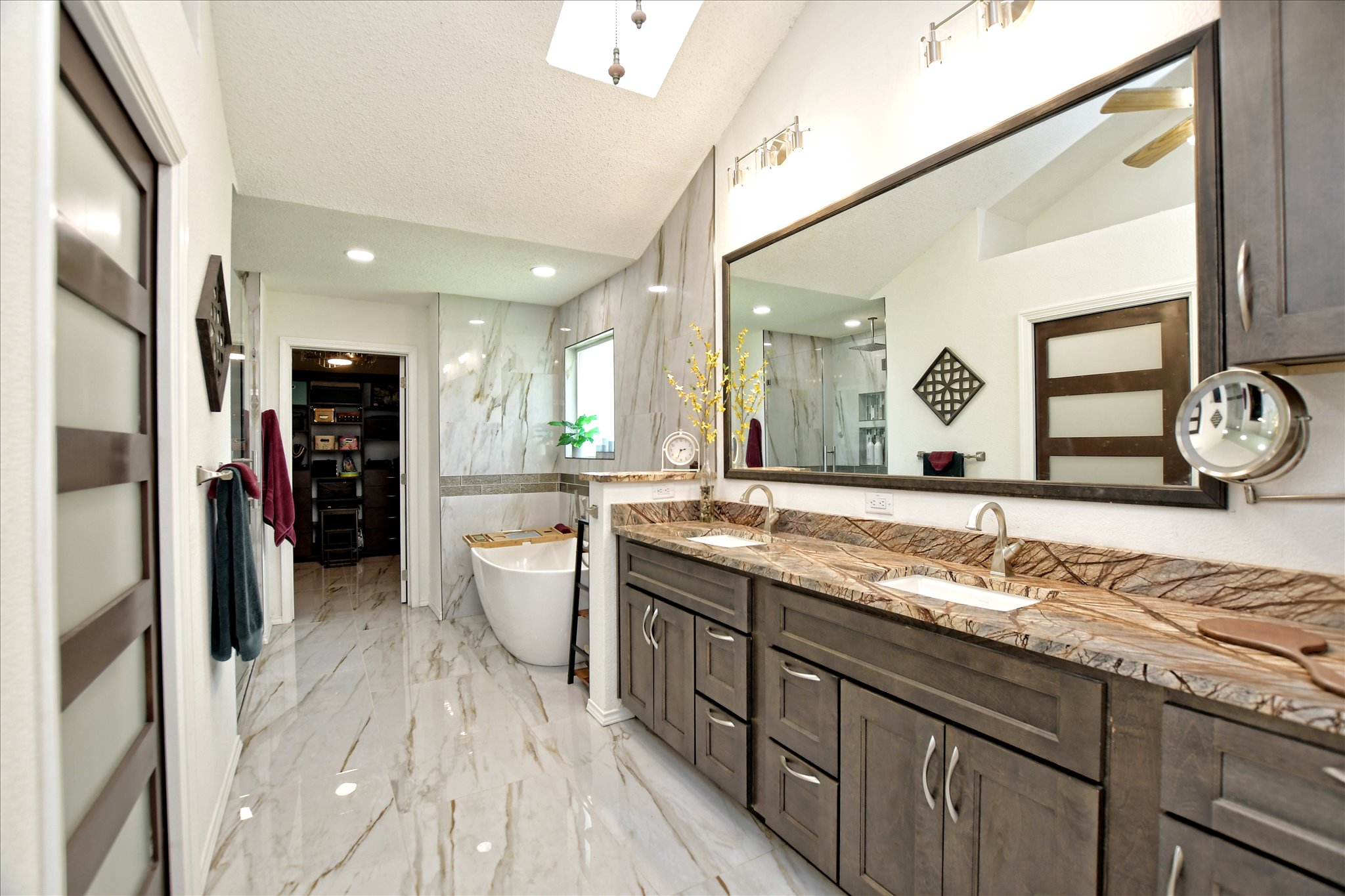 1002 West Noton Street Pflugerville, TX 78660 - Photo 20 of 32 The primary bathroom has a double vanity with granite countertops.