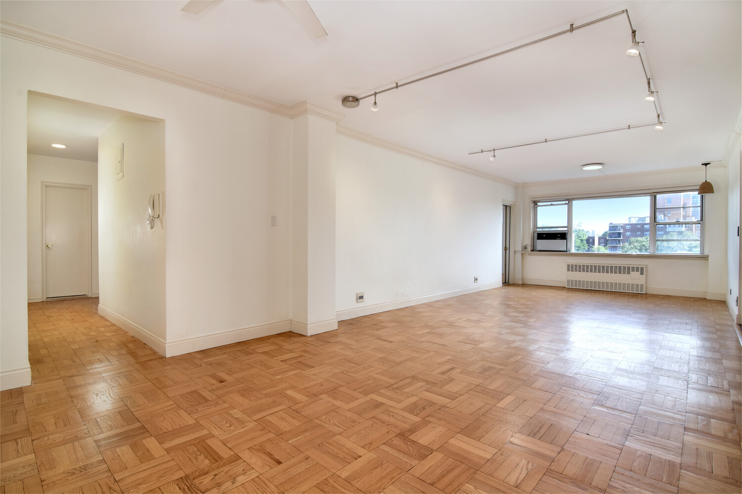750 Kappock Street, Unit 807 Bronx, NY 10463 - Photo 4 of 28 a view of a big room with wooden floor fire place and windows