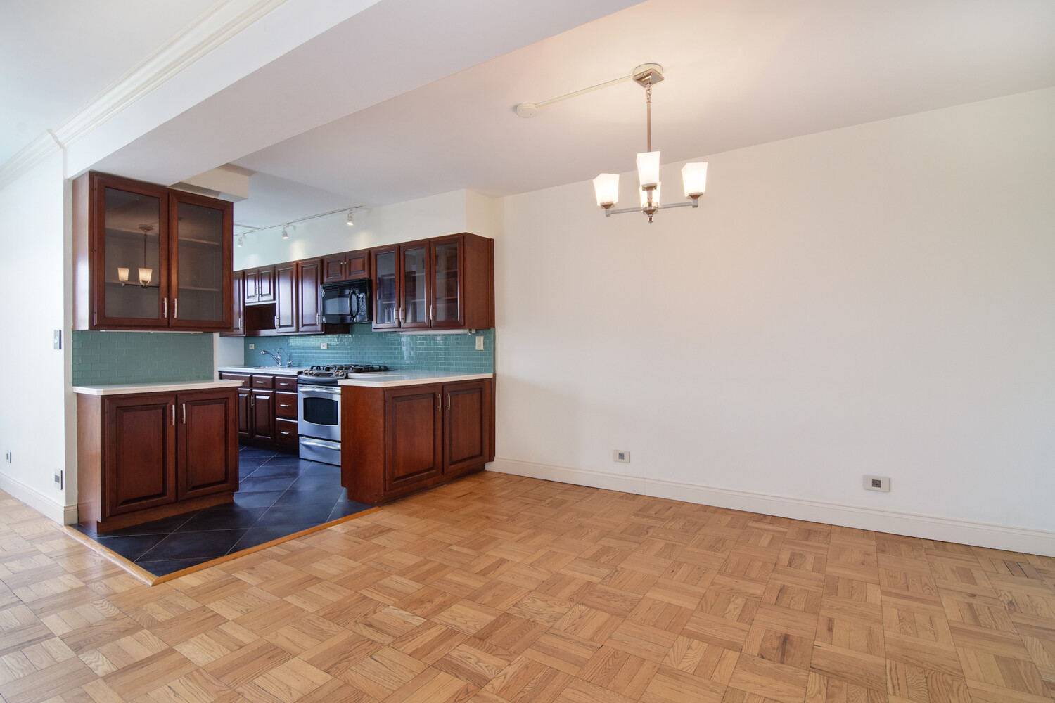 750 Kappock Street, Unit 807 Bronx, NY 10463 - Photo 8 of 28 a kitchen with stainless steel appliances granite countertop a sink a stove and a refrigerator