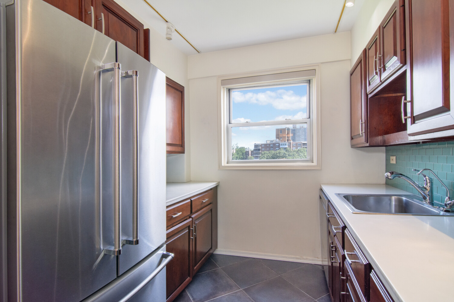 750 Kappock Street, Unit 807 Bronx, NY 10463 - Photo 9 of 28 a kitchen with a refrigerator and a sink