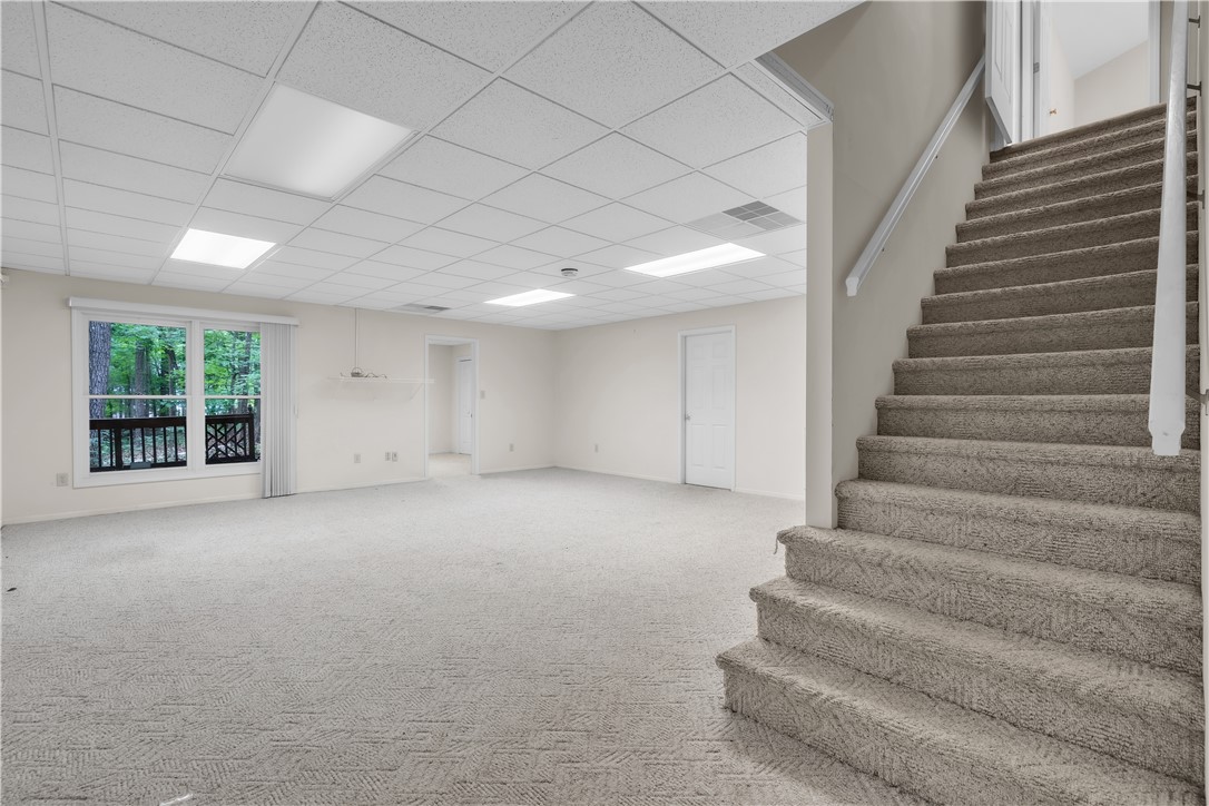 149 Inlet Pointe Drive Anderson, SC 29625 - Photo 11 of 43 A spacious lower-level area with ample lighting and walk-out access to the outdoors.