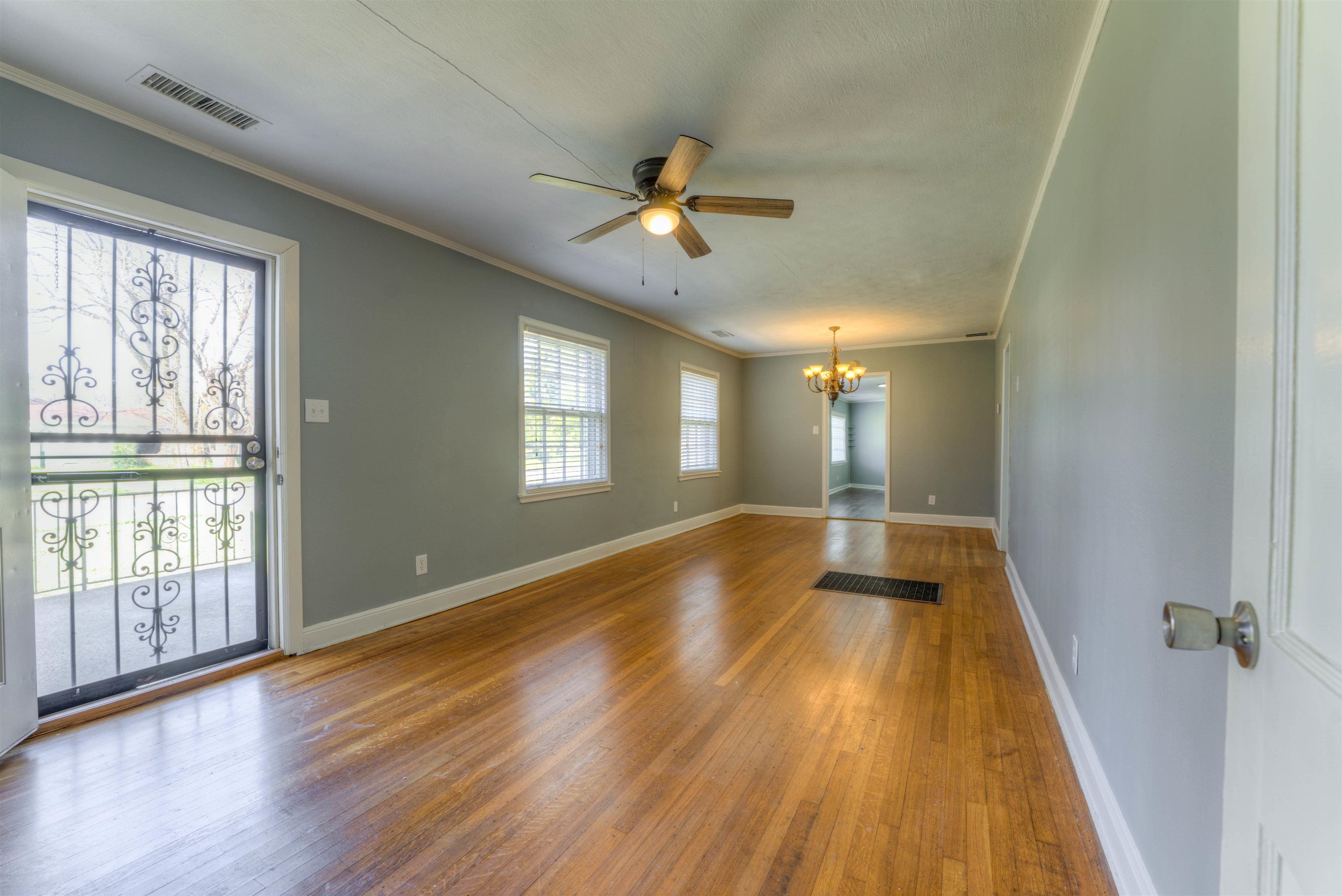 1180 Vaughn Road Memphis, TN 38122 - Photo 2 of 26 wooden floor in an empty room with a window
