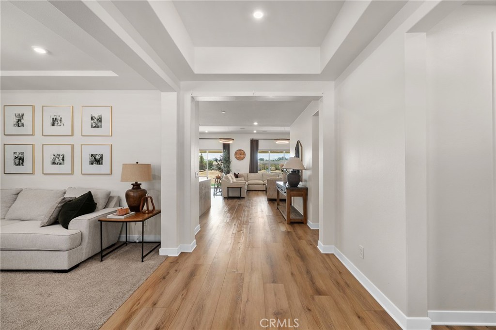 16155 New Canaan Court Riverside, CA 92504 - Photo 6 of 26 a living room with furniture and a wooden floor