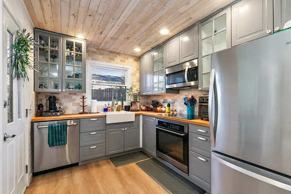 a view of a livingroom with furniture window and wooden floor