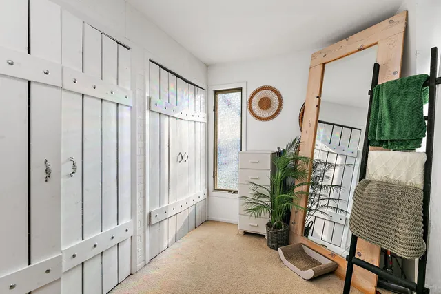 a bathroom with a sink a toilet and a window