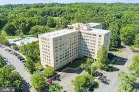 a view of a garden with an outdoor seating