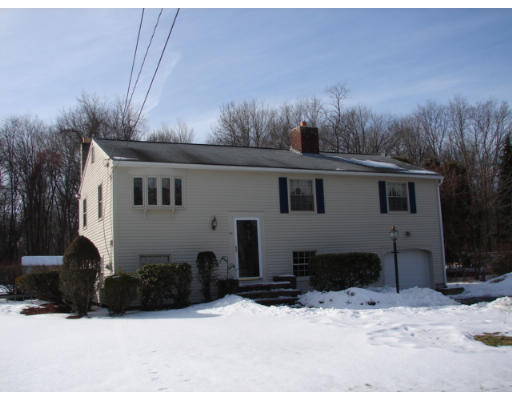 49 Ramshorn Road Dudley, MA 01571 - Photo 1 of 19 a view of a house with a yard covered in snow