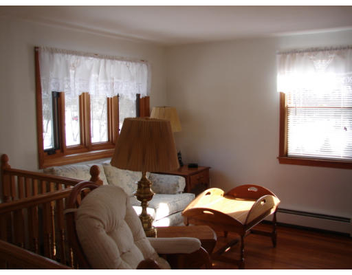 49 Ramshorn Road Dudley, MA 01571 - Photo 3 of 19 a balcony with chairs and a window