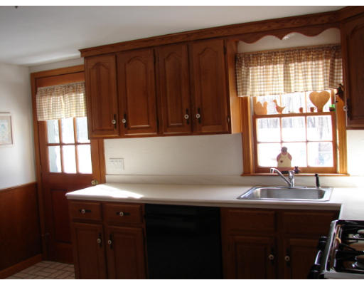 49 Ramshorn Road Dudley, MA 01571 - Photo 6 of 19 a kitchen with a sink a window and cabinets