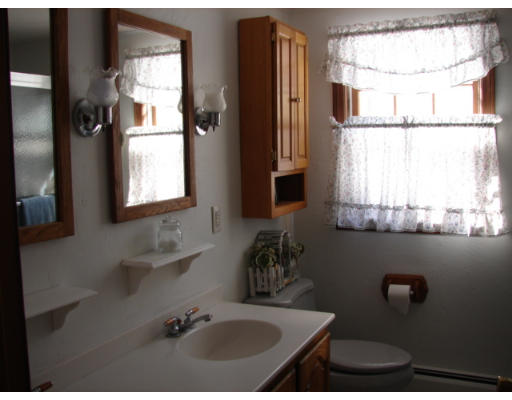 49 Ramshorn Road Dudley, MA 01571 - Photo 7 of 19 a bathroom with a sink and a window