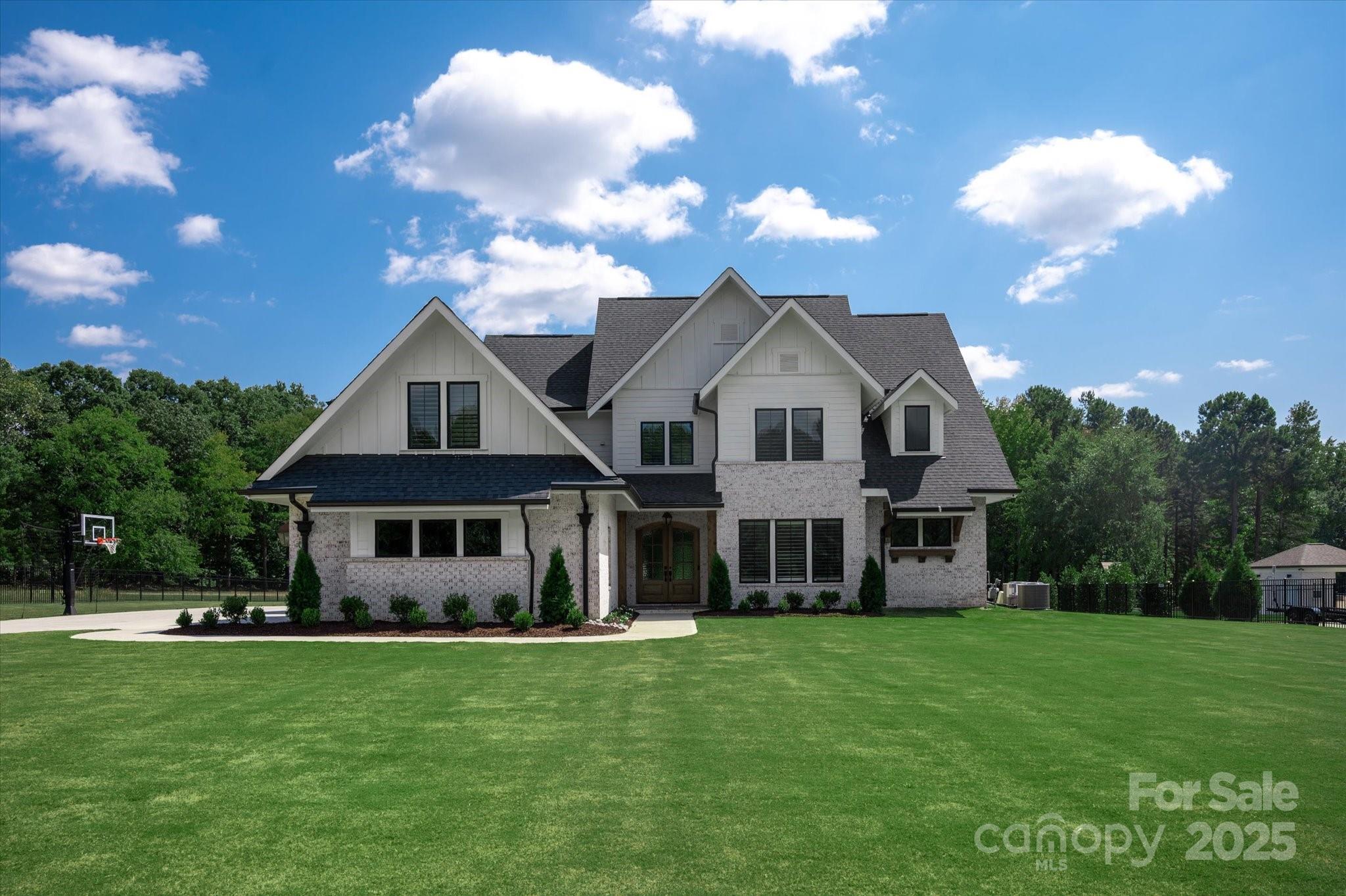 1405 Waxhaw-Marvin Road Waxhaw, NC 28173 - Photo 1 of 46 a front view of a house with a yard
